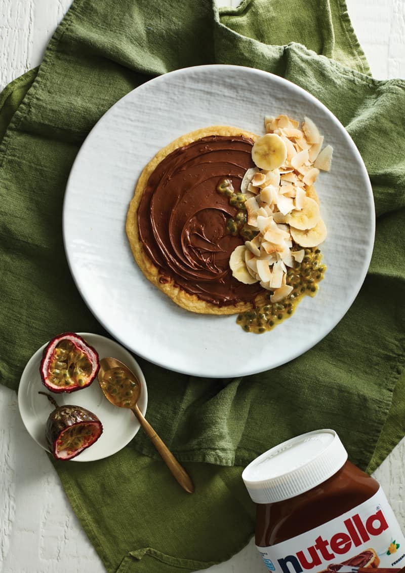 Banana Nutella pancakes with passionfruit and coconut